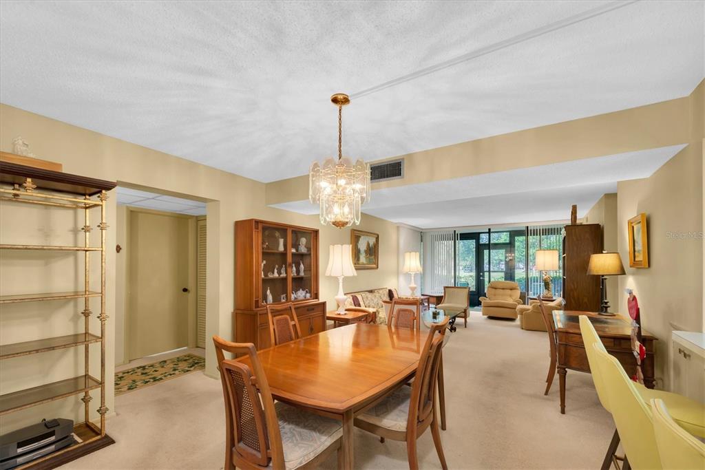 12300 Vonn Road, Unit 4101 Largo, FL 33774 - Photo 18 of 46 a view of a dining room with furniture and wooden floor