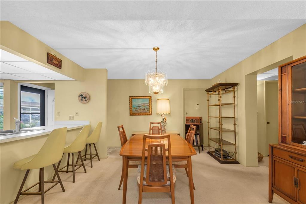 12300 Vonn Road, Unit 4101 Largo, FL 33774 - Photo 19 of 46 a view of a dining room with furniture and window