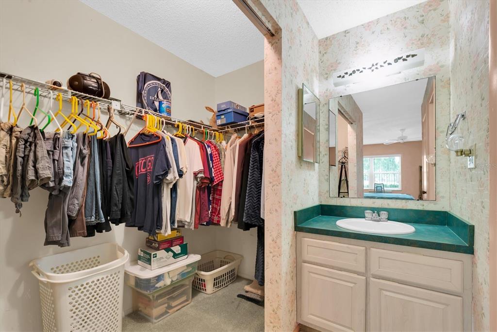 12300 Vonn Road, Unit 4101 Largo, FL 33774 - Photo 24 of 46 a bathroom with a sink double vanity and mirror