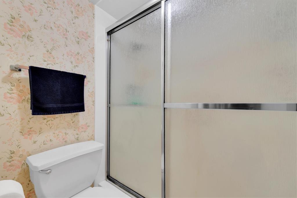 12300 Vonn Road, Unit 4101 Largo, FL 33774 - Photo 25 of 46 a bathroom with a shower and a bathtub