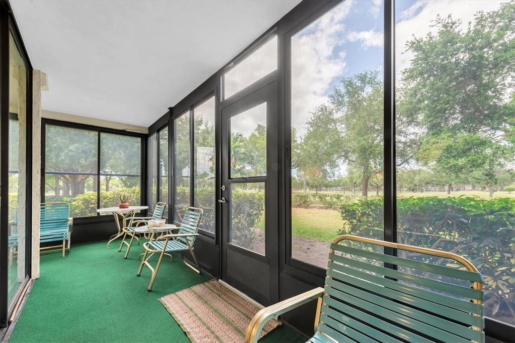 12300 Vonn Road, Unit 4101 Largo, FL 33774 - Photo 26 of 46 a living room with couch and a floor to ceiling window