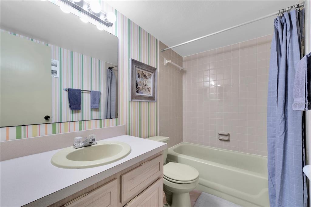 12300 Vonn Road, Unit 4101 Largo, FL 33774 - Photo 31 of 46 a bathroom with a sink and a mirror
