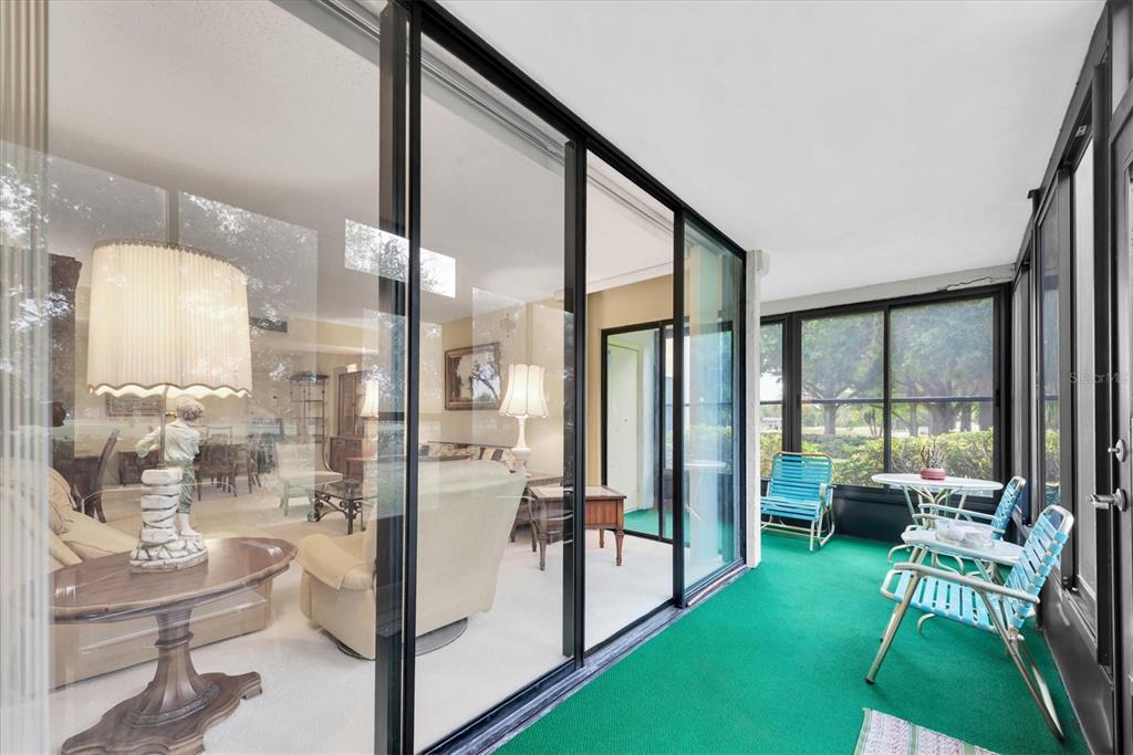 12300 Vonn Road, Unit 4101 Largo, FL 33774 - Photo 32 of 46 a living room with a floor to ceiling window and furniture