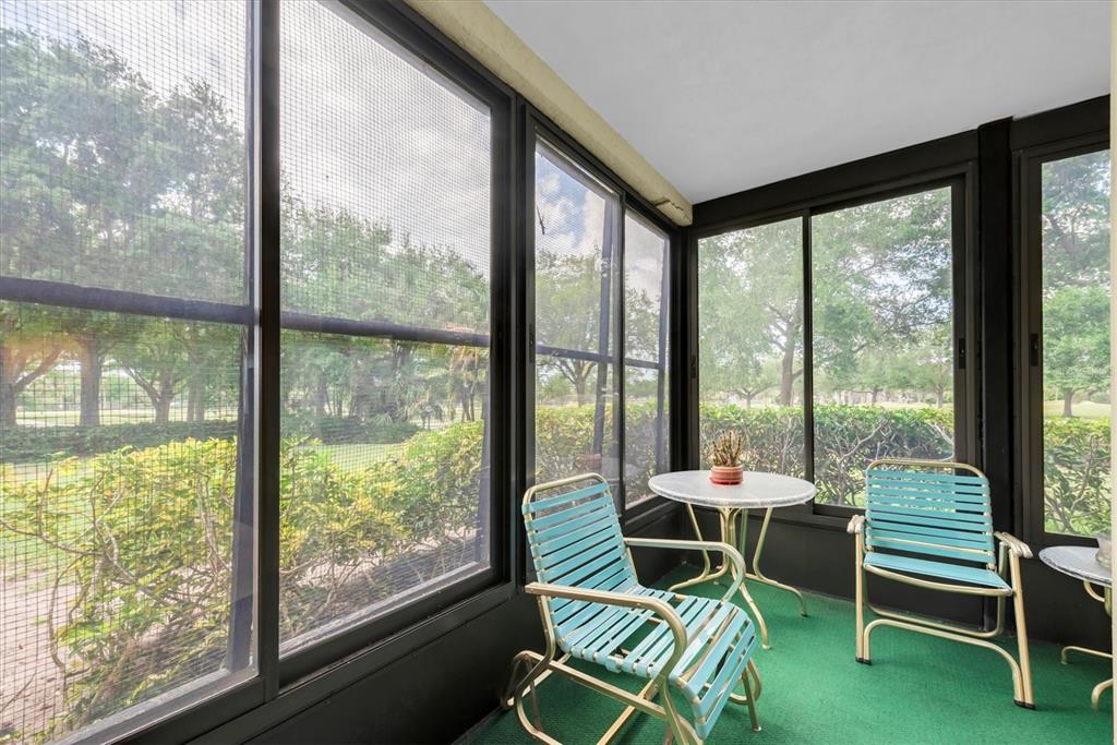 12300 Vonn Road, Unit 4101 Largo, FL 33774 - Photo 33 of 46 a work room with glass windows and furniture