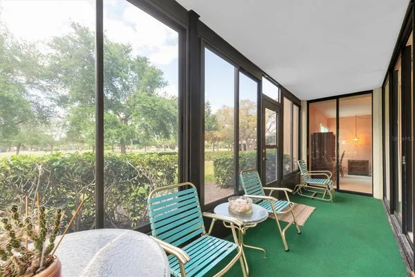 an aerial view of a house with a yard and sitting area