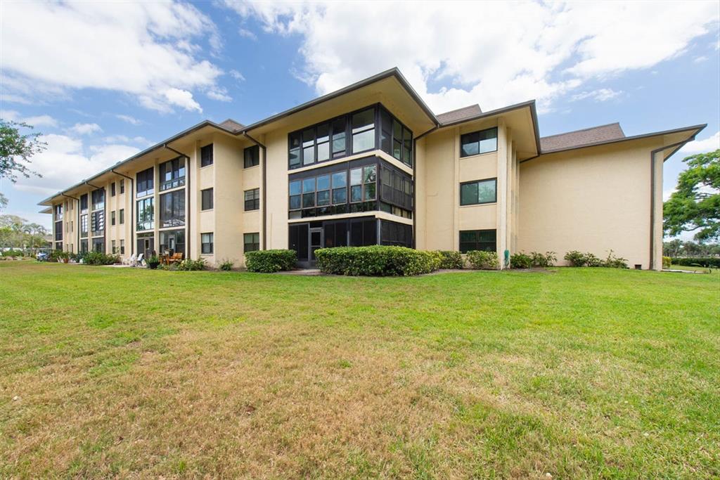 12300 Vonn Road, Unit 4101 Largo, FL 33774 - Photo 41 of 46 a front view of a house with a yard