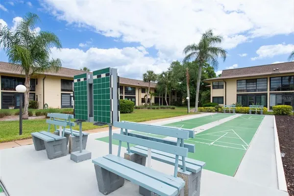 a front view of a building with a garden