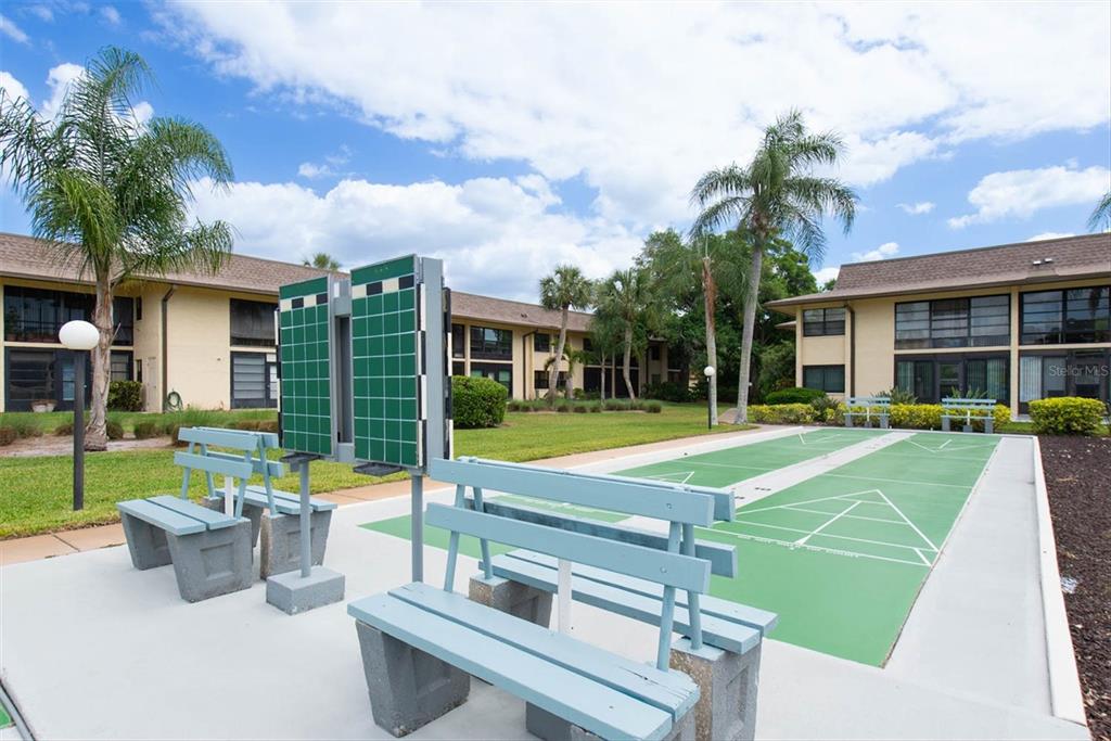 12300 Vonn Road, Unit 4101 Largo, FL 33774 - Photo 45 of 46 a view of a house with swimming pool and a yard