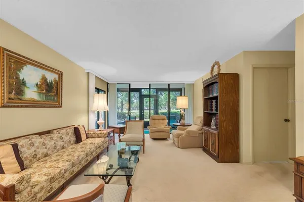 a living room with furniture and a table