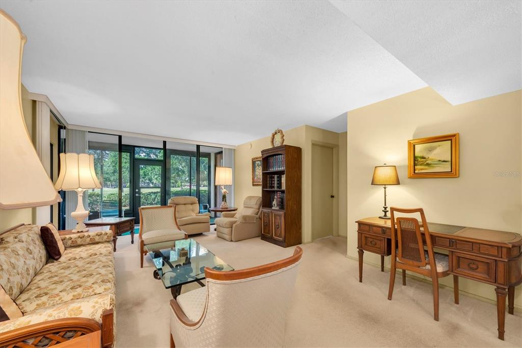 12300 Vonn Road, Unit 4101 Largo, FL 33774 - Photo 10 of 46 a living room with furniture and a table