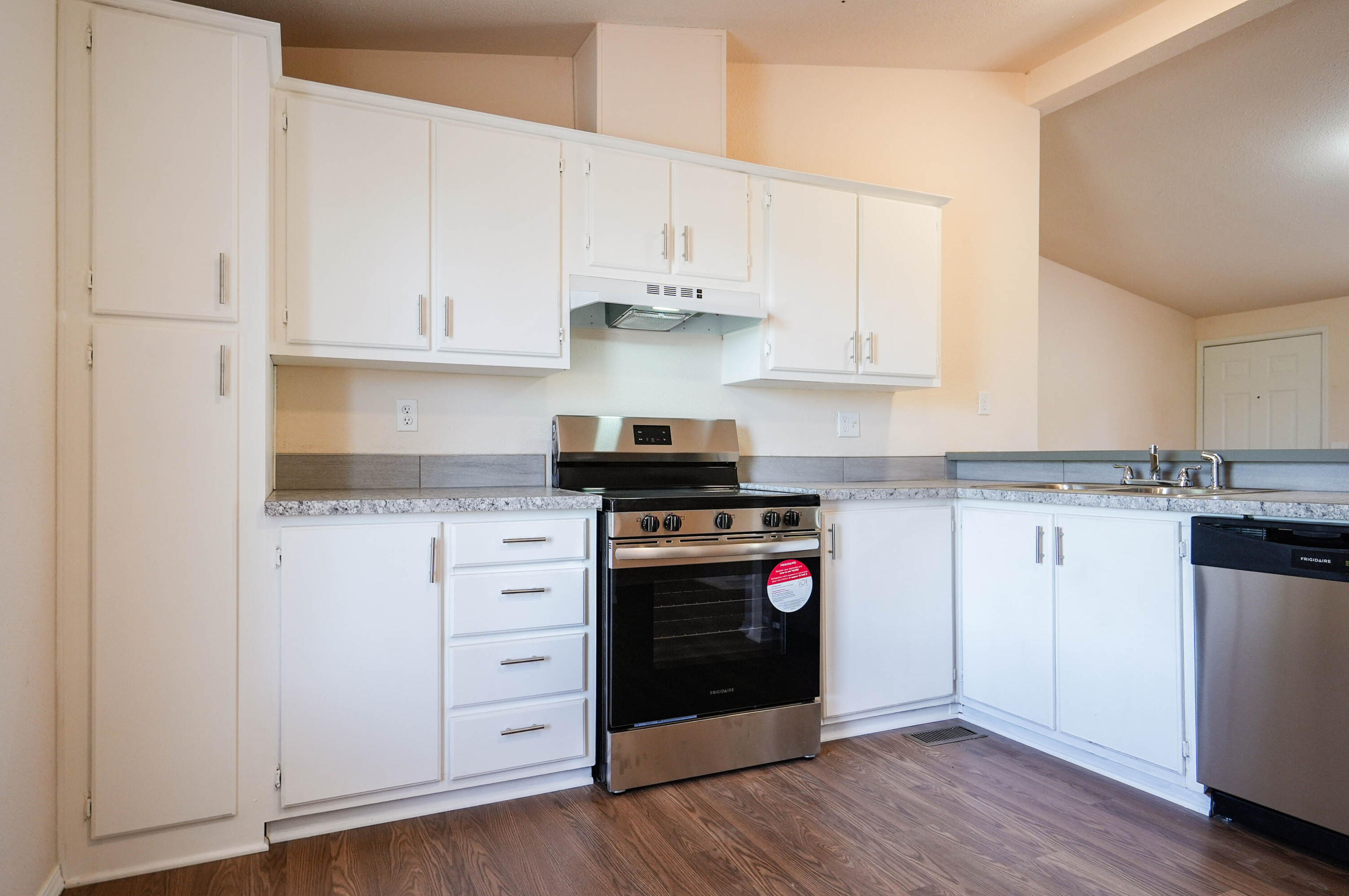 25016 Drews Road Chiloquin, OR 97624 - Photo 18 of 54 a kitchen with white cabinets and appliances