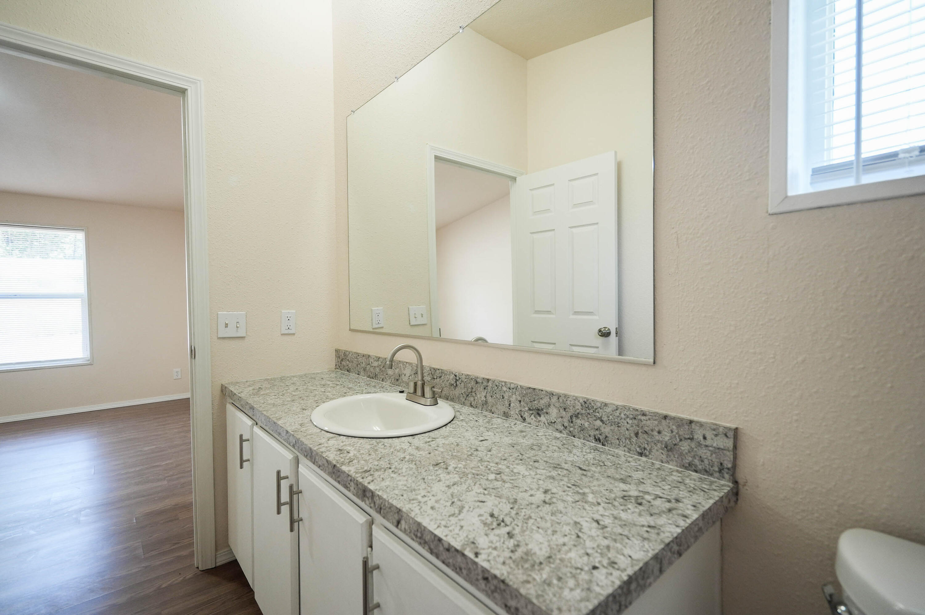 25016 Drews Road Chiloquin, OR 97624 - Photo 27 of 54 a bathroom with a granite countertop sink and a mirror