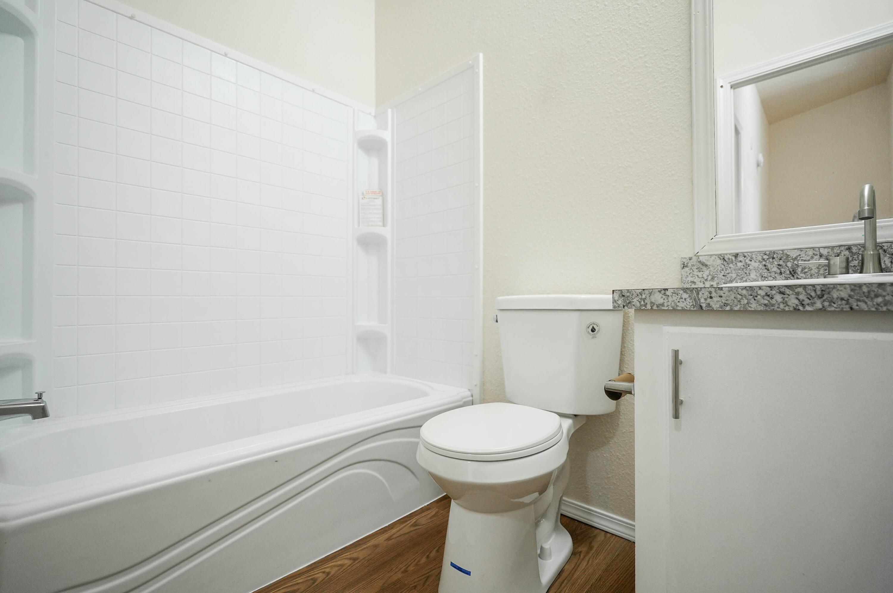 25016 Drews Road Chiloquin, OR 97624 - Photo 32 of 54 a bathroom with a granite countertop toilet a sink and bathtub