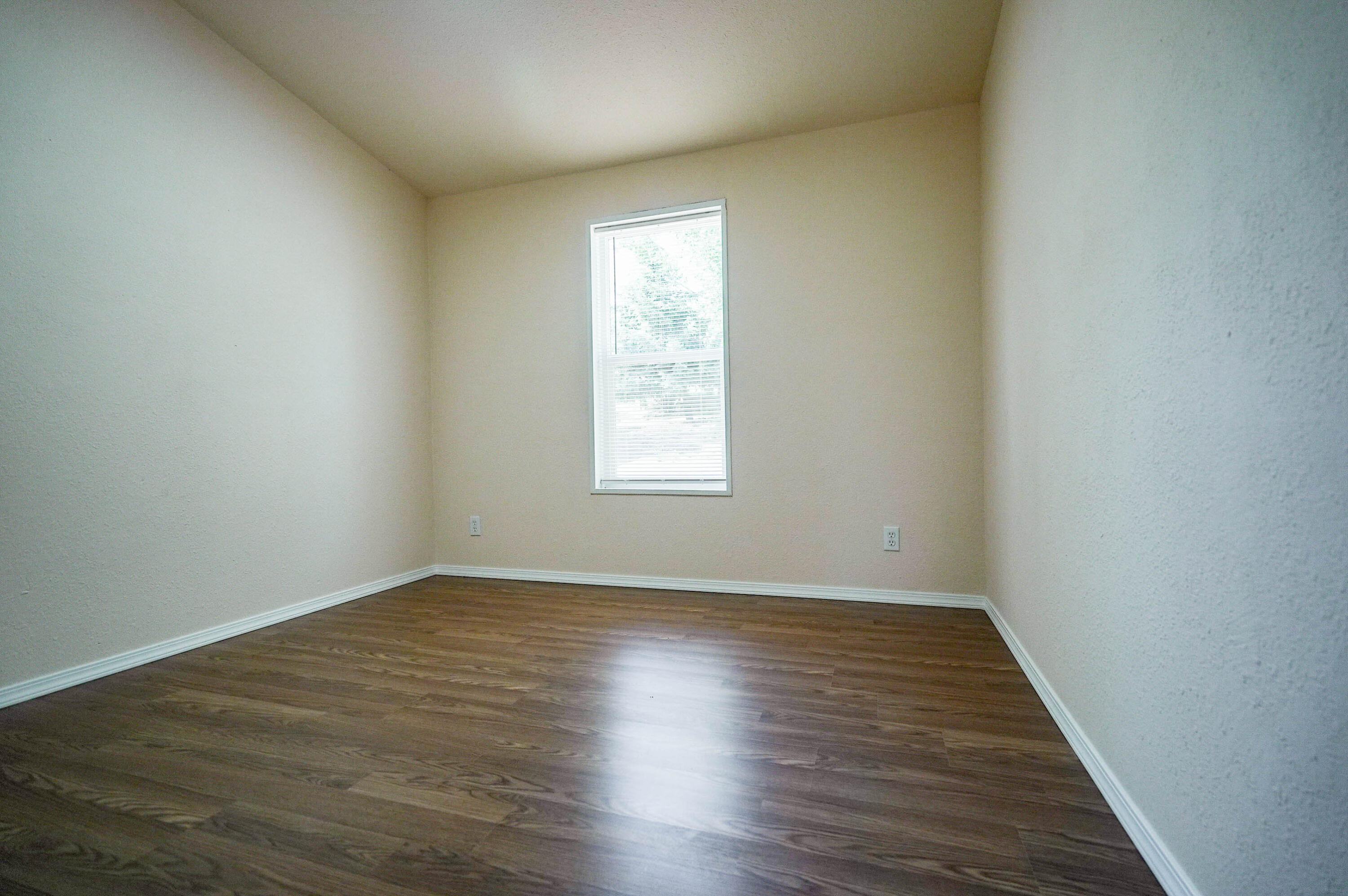 25016 Drews Road Chiloquin, OR 97624 - Photo 34 of 54 an empty room with wooden floor and windows