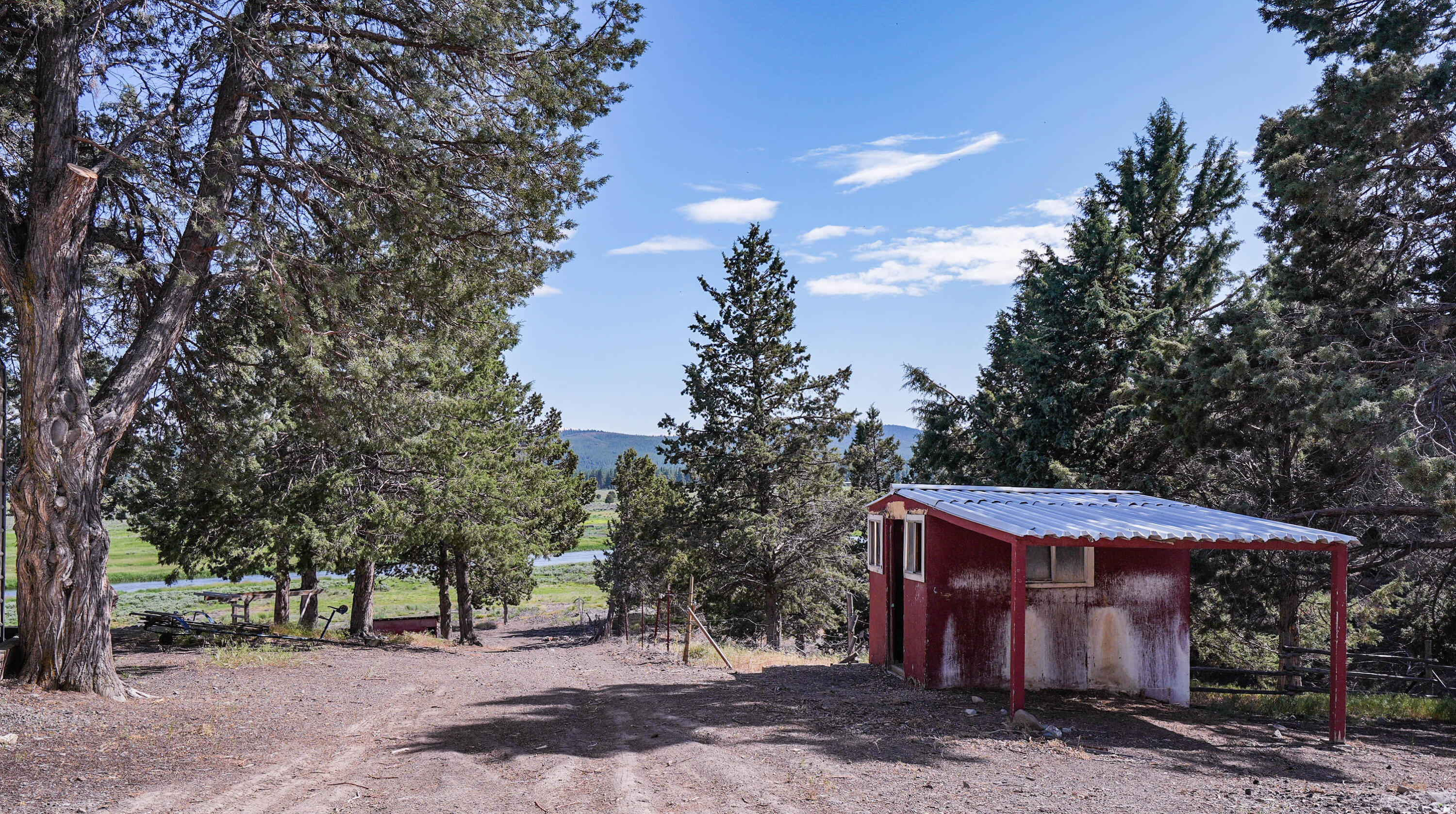 25016 Drews Road Chiloquin, OR 97624 - Photo 42 of 54 a view of a barn with a tree
