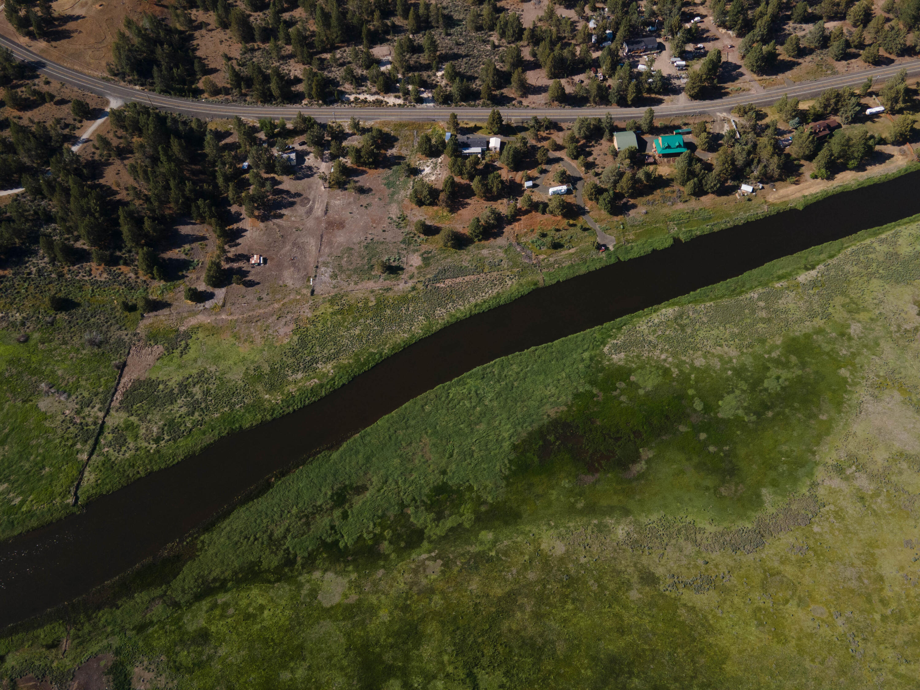25016 Drews Road Chiloquin, OR 97624 - Photo 50 of 54 an aerial view of residential houses with outdoor space and trees