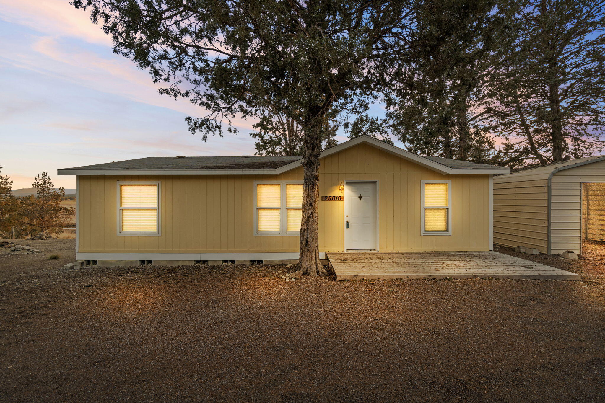 25016 Drews Road Chiloquin, OR 97624 - Photo 5 of 54 a view of a house with a garden