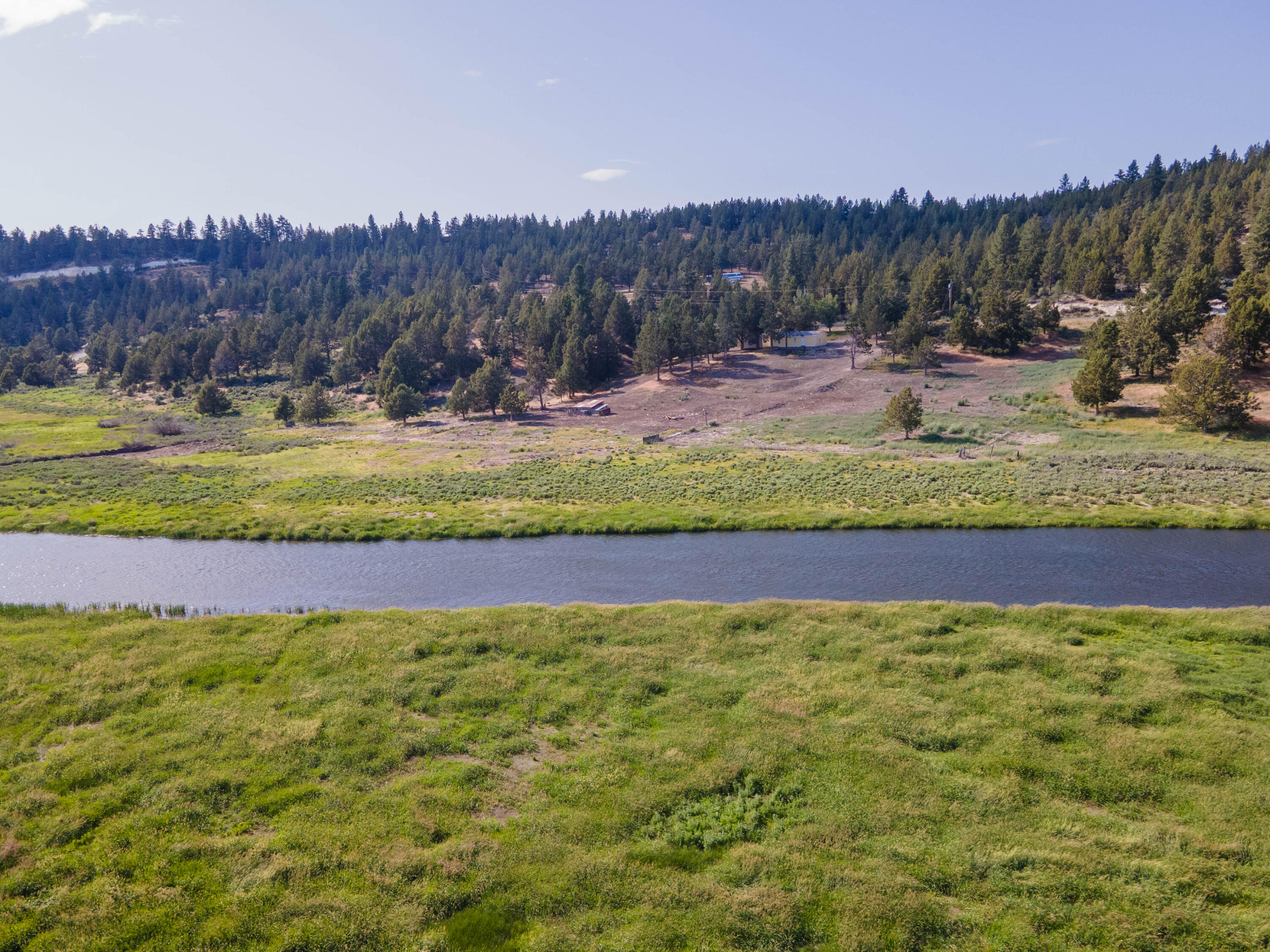 25016 Drews Road Chiloquin, OR 97624 - Photo 54 of 54 a view of a yard with a swimming pool and trees