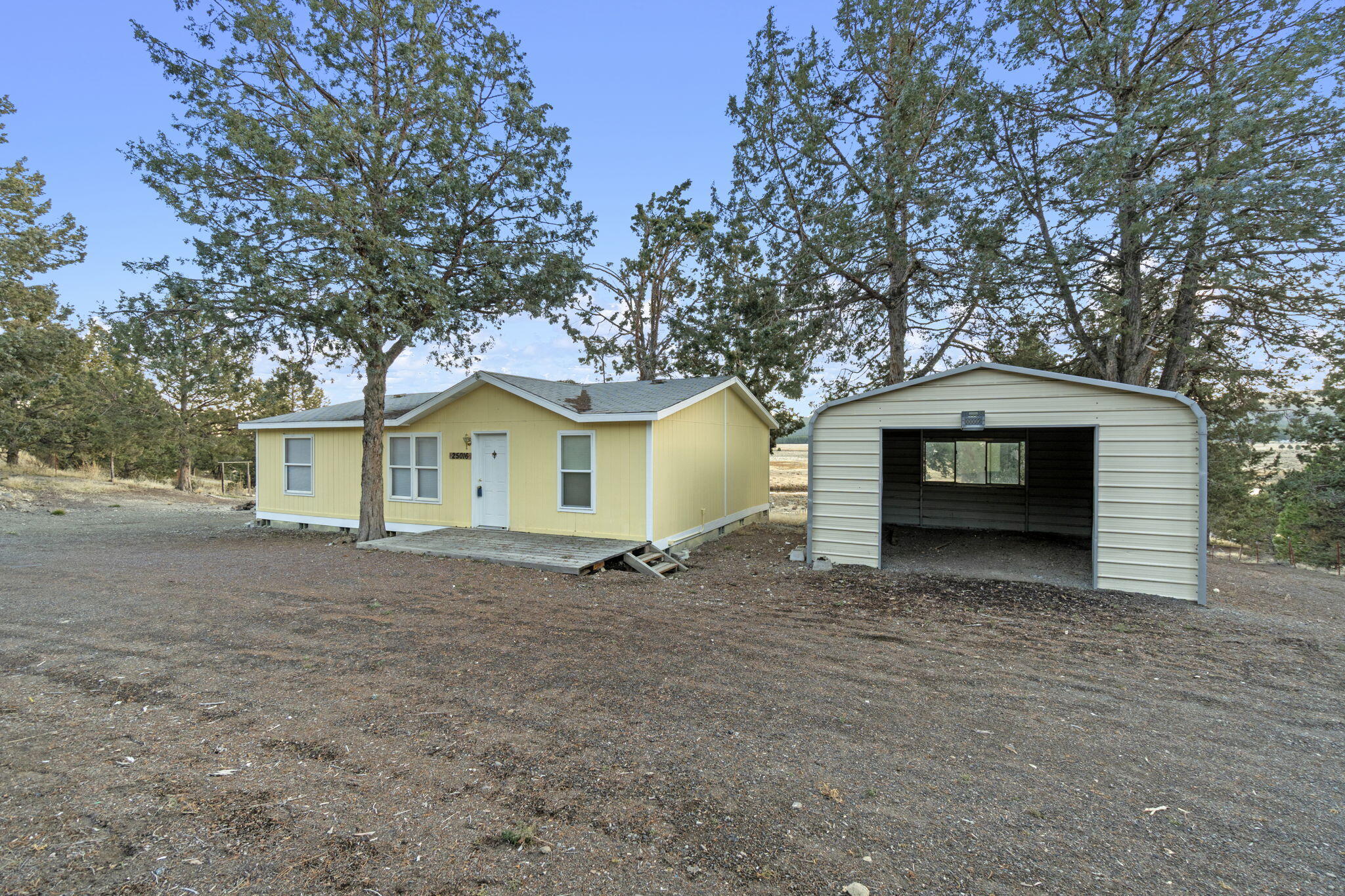 25016 Drews Road Chiloquin, OR 97624 - Photo 6 of 54 a house with trees in the background