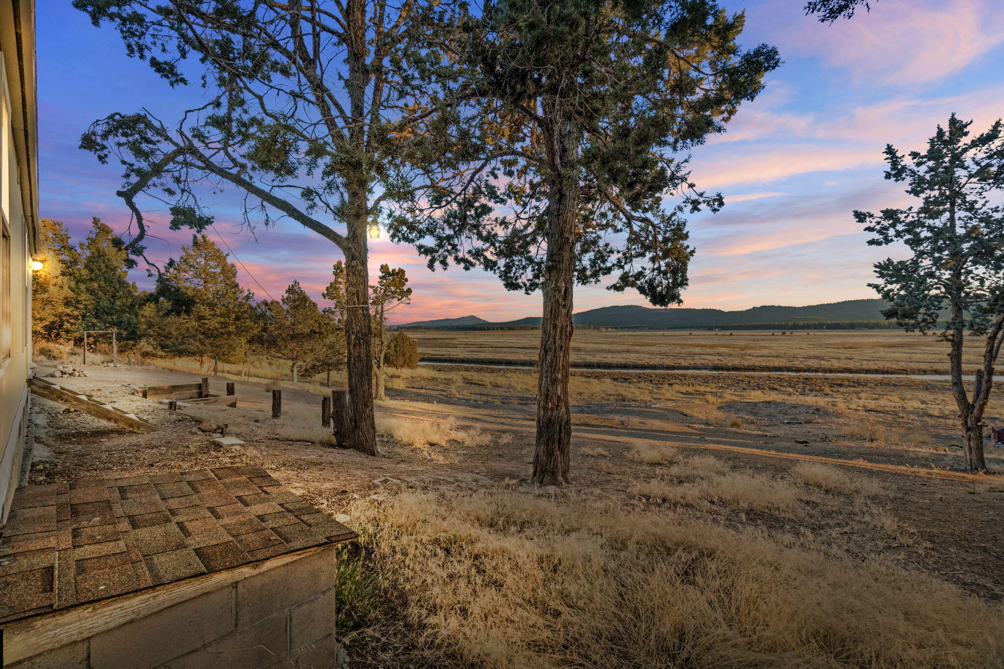 25016 Drews Road Chiloquin, OR 97624 - Photo 8 of 54 a view of a yard with wooden fence