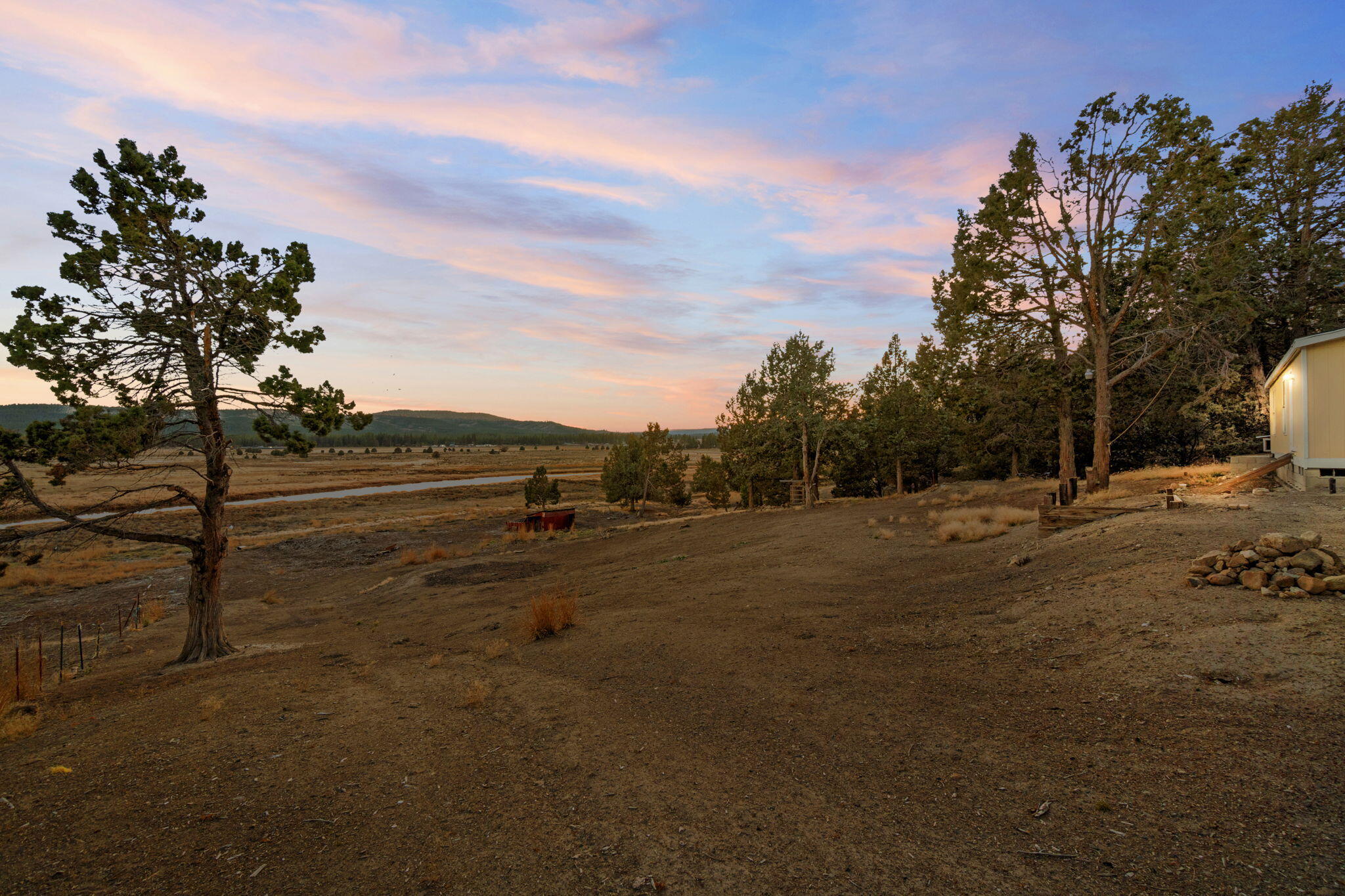 25016 Drews Road Chiloquin, OR 97624 - Photo 9 of 54 a view of dirt field with trees