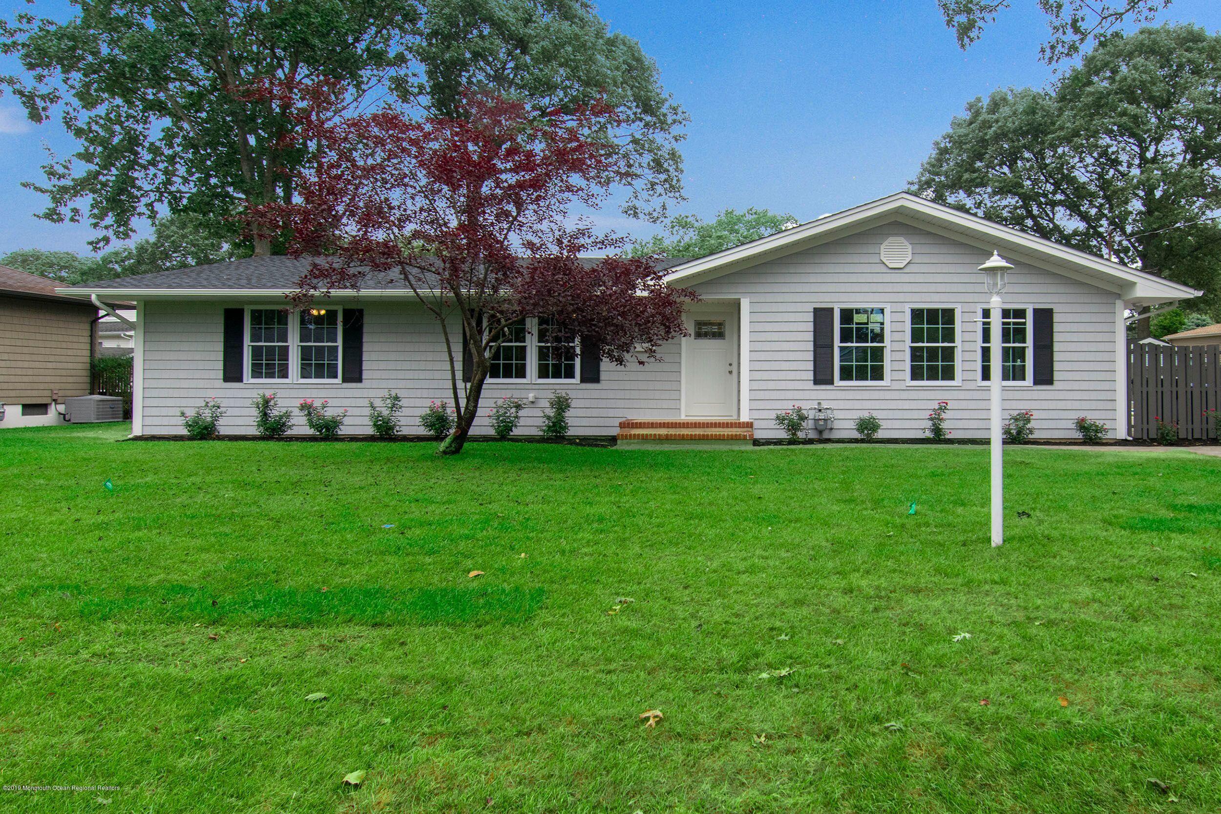 654 Thoroughfare Road Brick, NJ 08724 - Photo 1 of 17 a front view of house with yard and green space