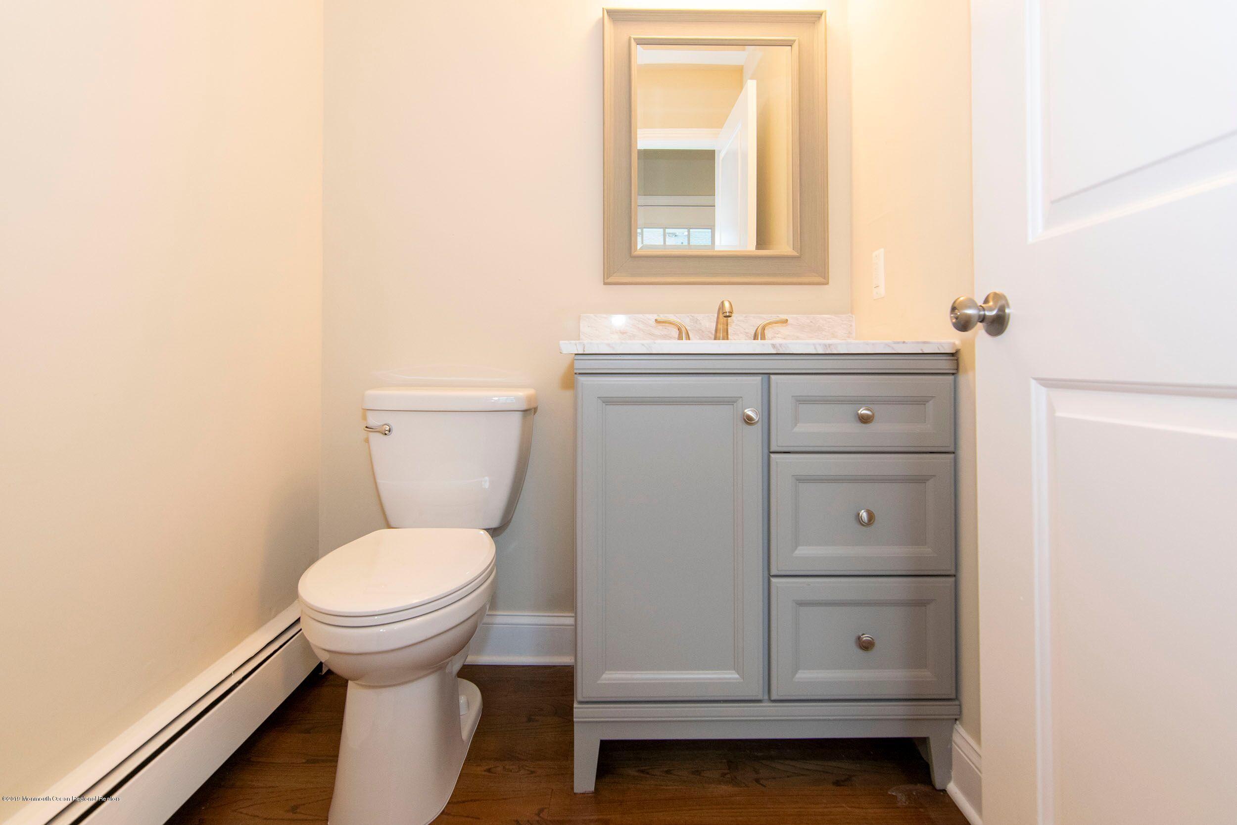 654 Thoroughfare Road Brick, NJ 08724 - Photo 14 of 17 a bathroom with a sink and a toilet
