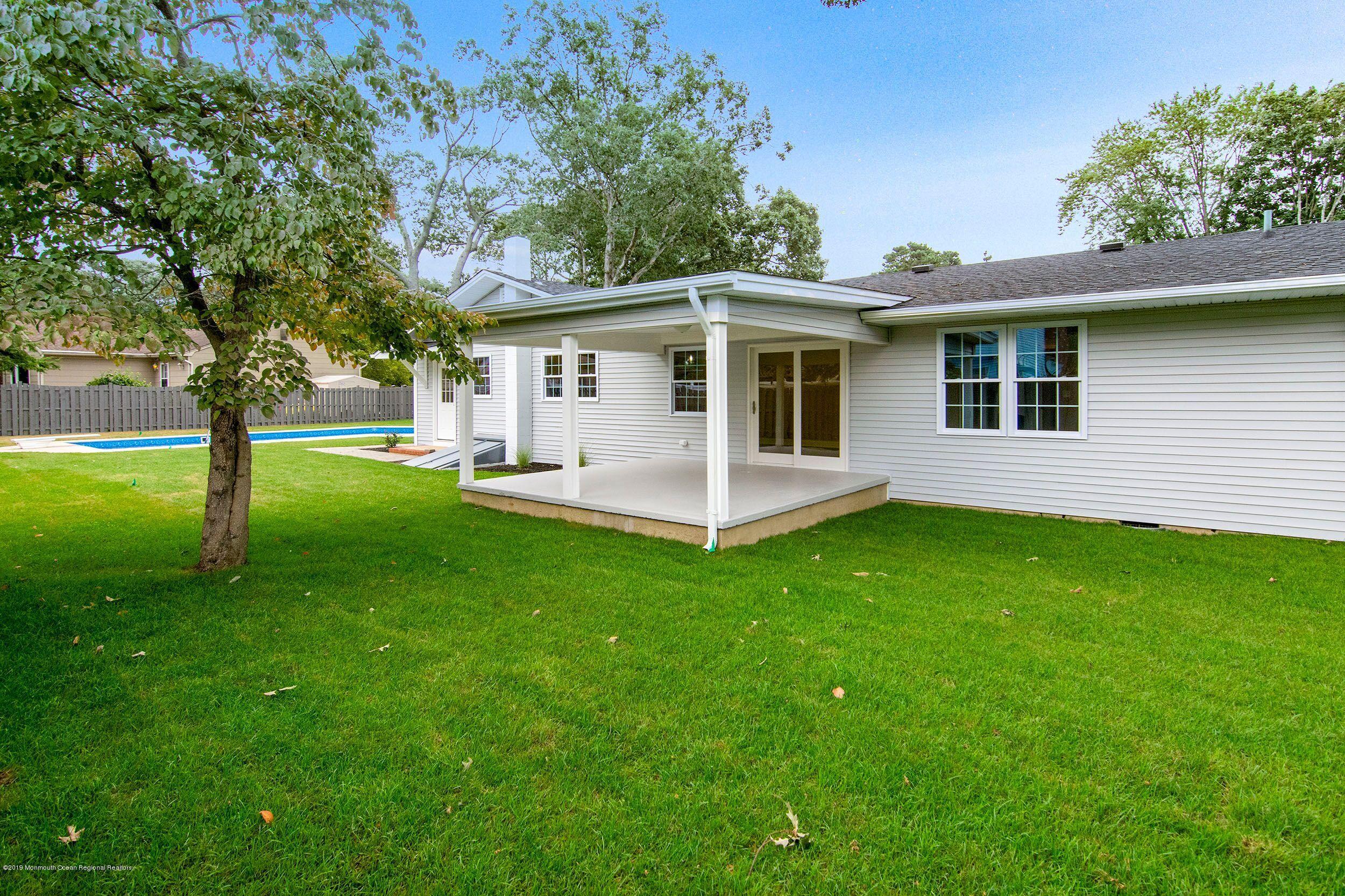 654 Thoroughfare Road Brick, NJ 08724 - Photo 15 of 17 a view of a house with a backyard