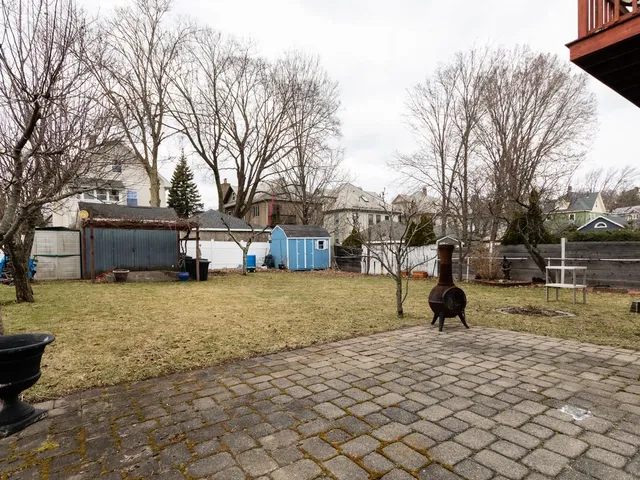 a view of a yard with a tiny play house