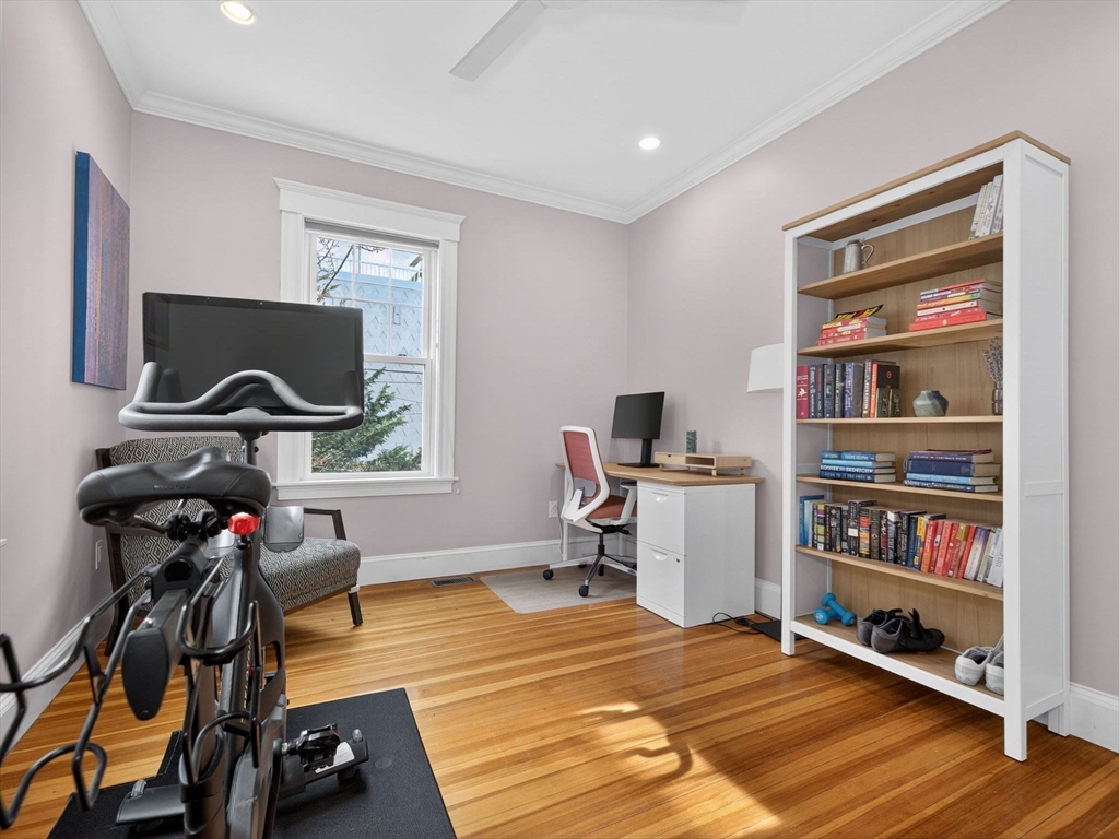 71 Parkton Road, Unit 2 Boston, MA 02130 - Photo 13 of 26 a view of a workspace with furniture and a flat screen tv