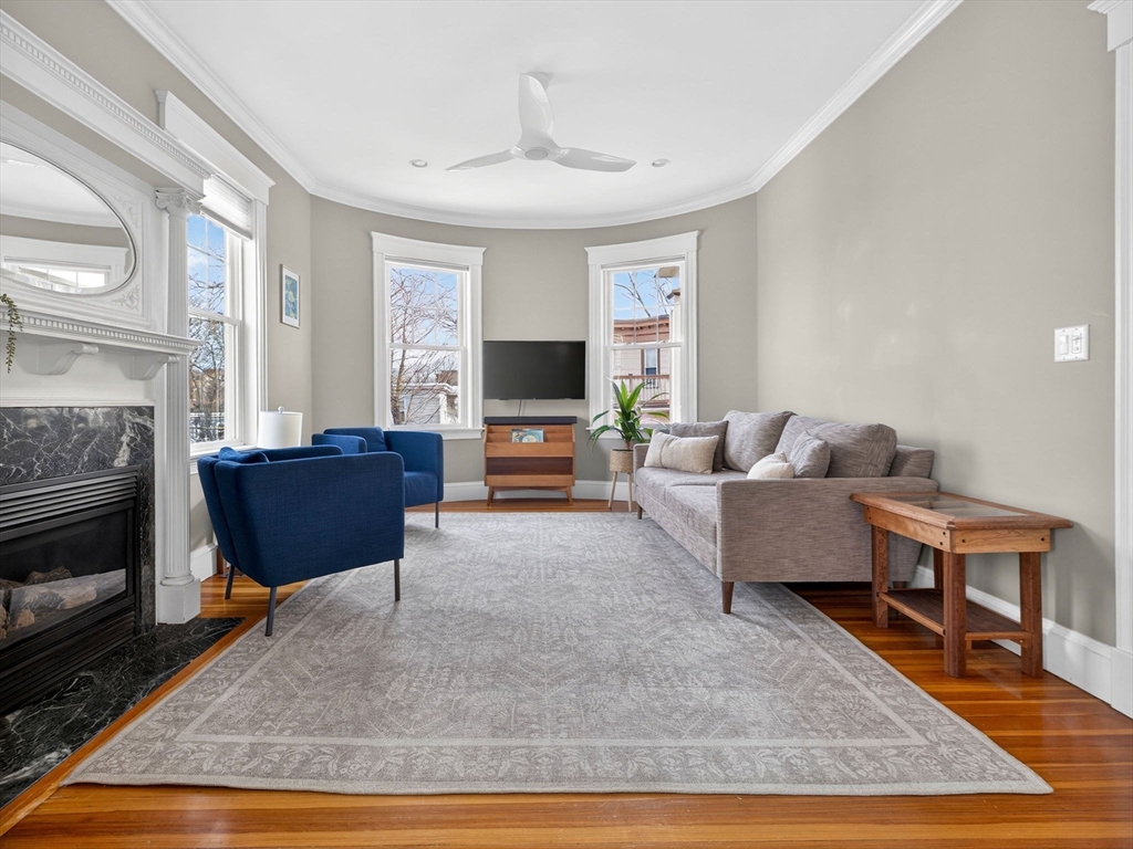 71 Parkton Road, Unit 2 Boston, MA 02130 - Photo 3 of 26 a living room with furniture and a fireplace