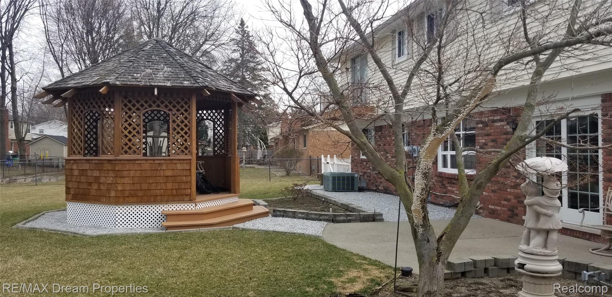 6533 Flintlock Ridge Utica, MI 48317 - Photo 32 of 53 GORGEOUS YARD WITH CUSTOM CEDAR GAZEBO WITH ELECTRICITY