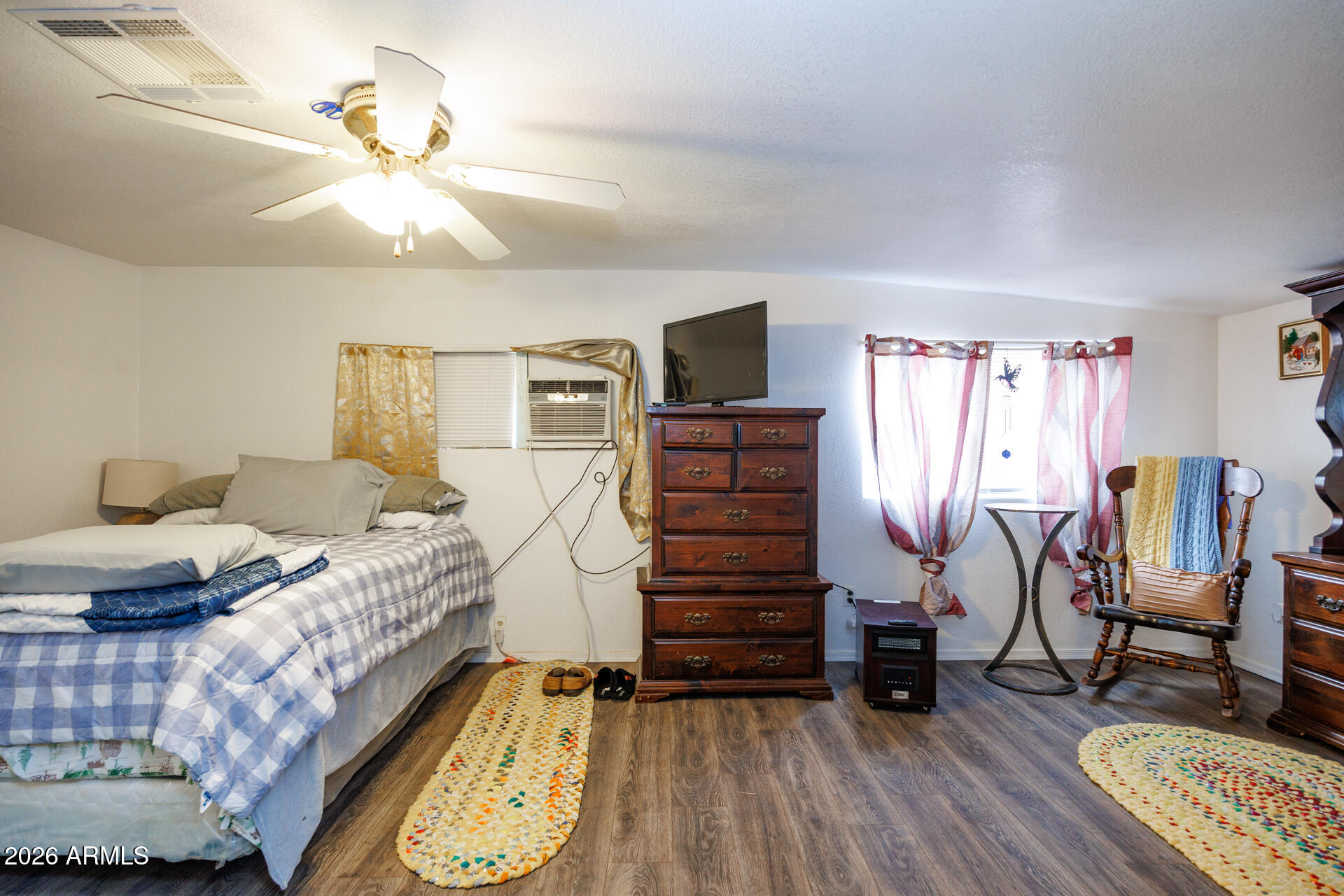 6185 East Monitor Street Picacho, AZ 85141 - Photo 52 of 55 a bedroom with furniture and wooden floor
