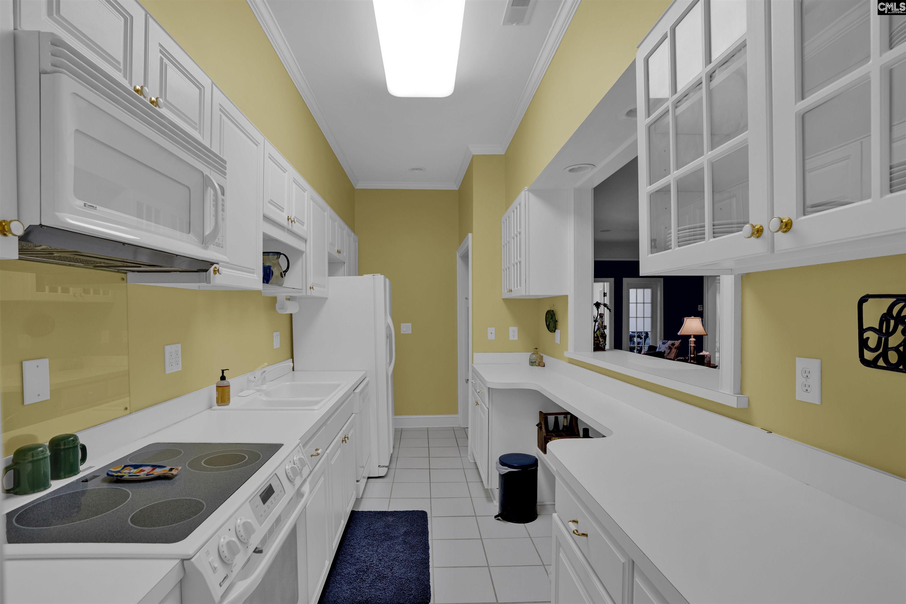 1101 Ellett Road Chapin, SC 29036 - Photo 12 of 24 a kitchen with a sink a stove and cabinets