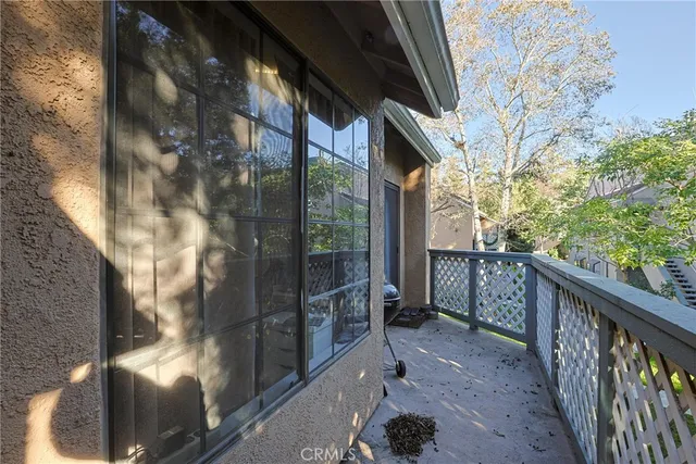 a view of balcony with wooden floor