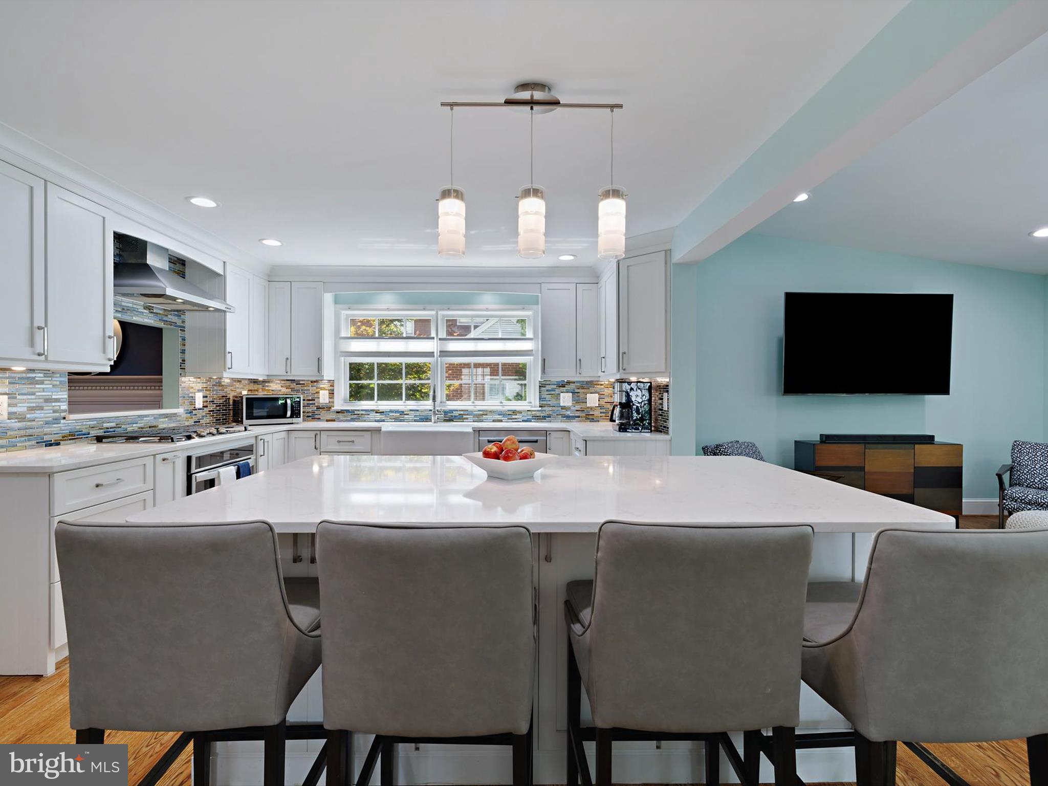 6 Brice Road Annapolis, MD 21409 - Photo 12 of 107 a kitchen with stainless steel appliances a table and chairs
