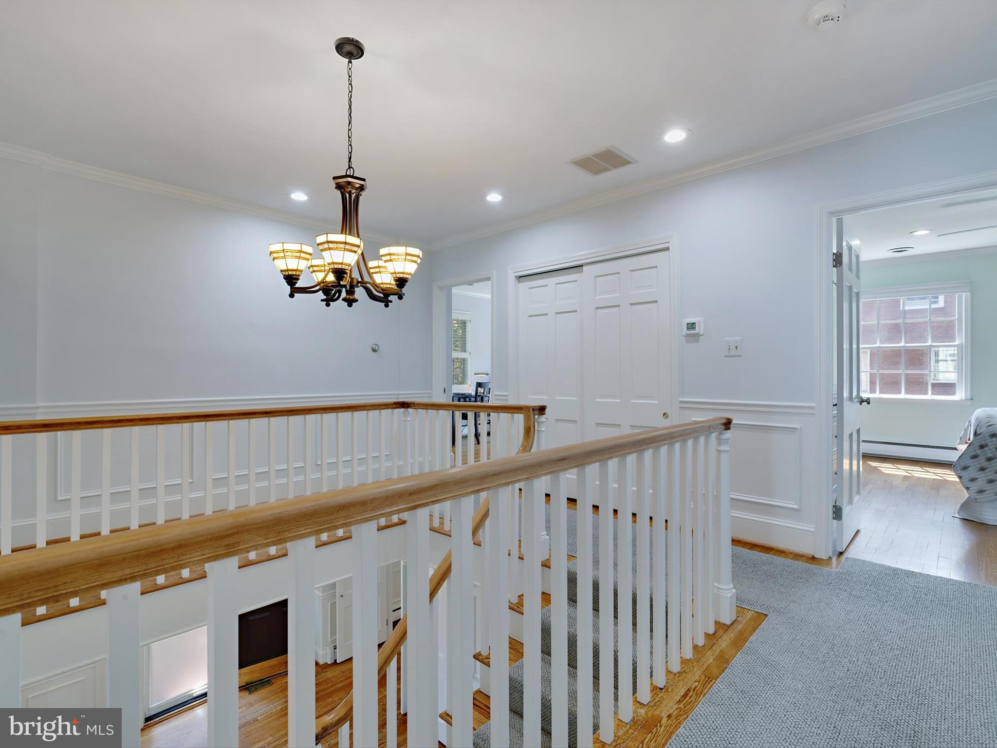 6 Brice Road Annapolis, MD 21409 - Photo 22 of 107 a view of a room with a chandelier fan and wooden floor