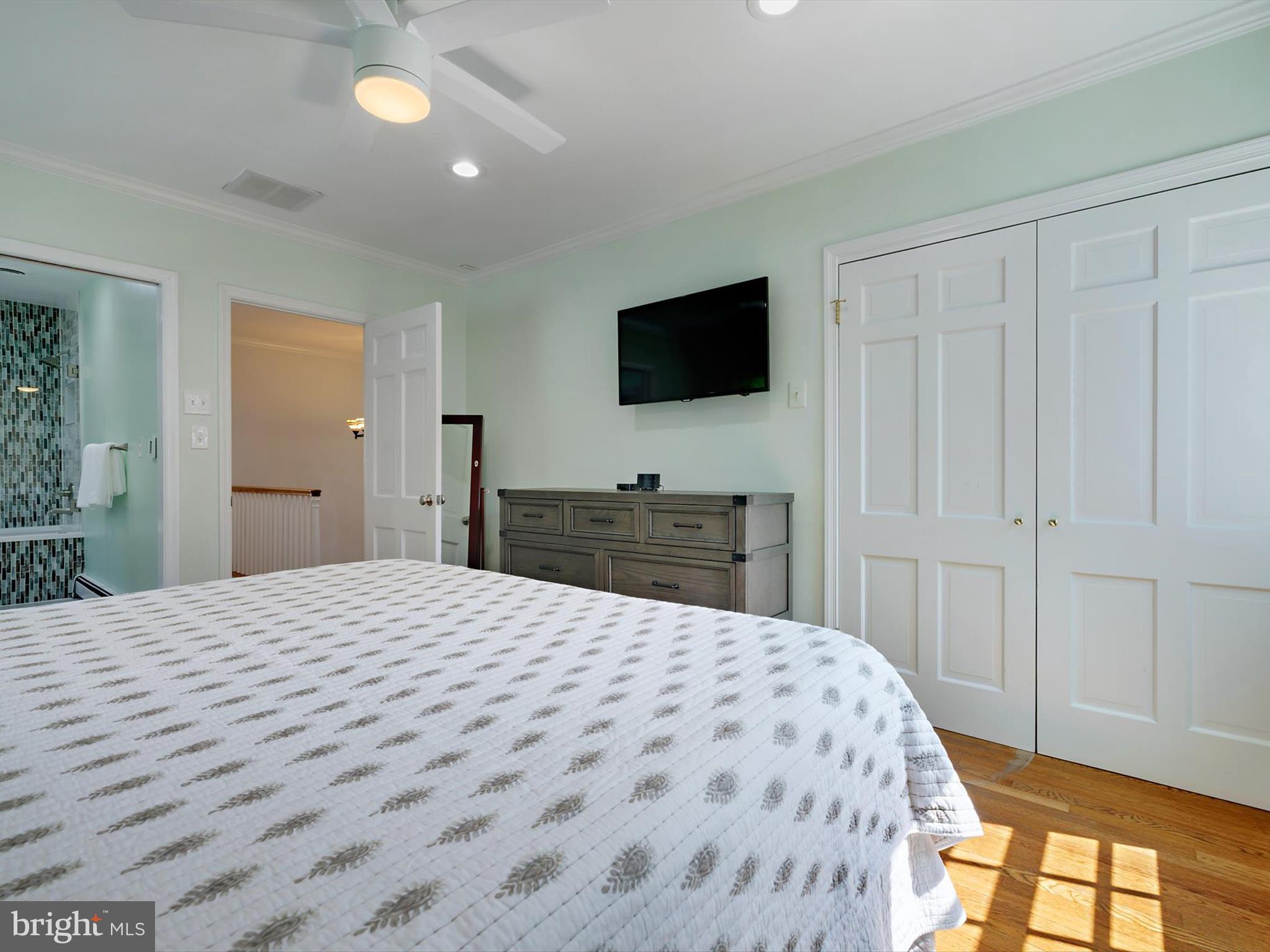 6 Brice Road Annapolis, MD 21409 - Photo 24 of 107 a large bedroom with a bed and a flat screen tv