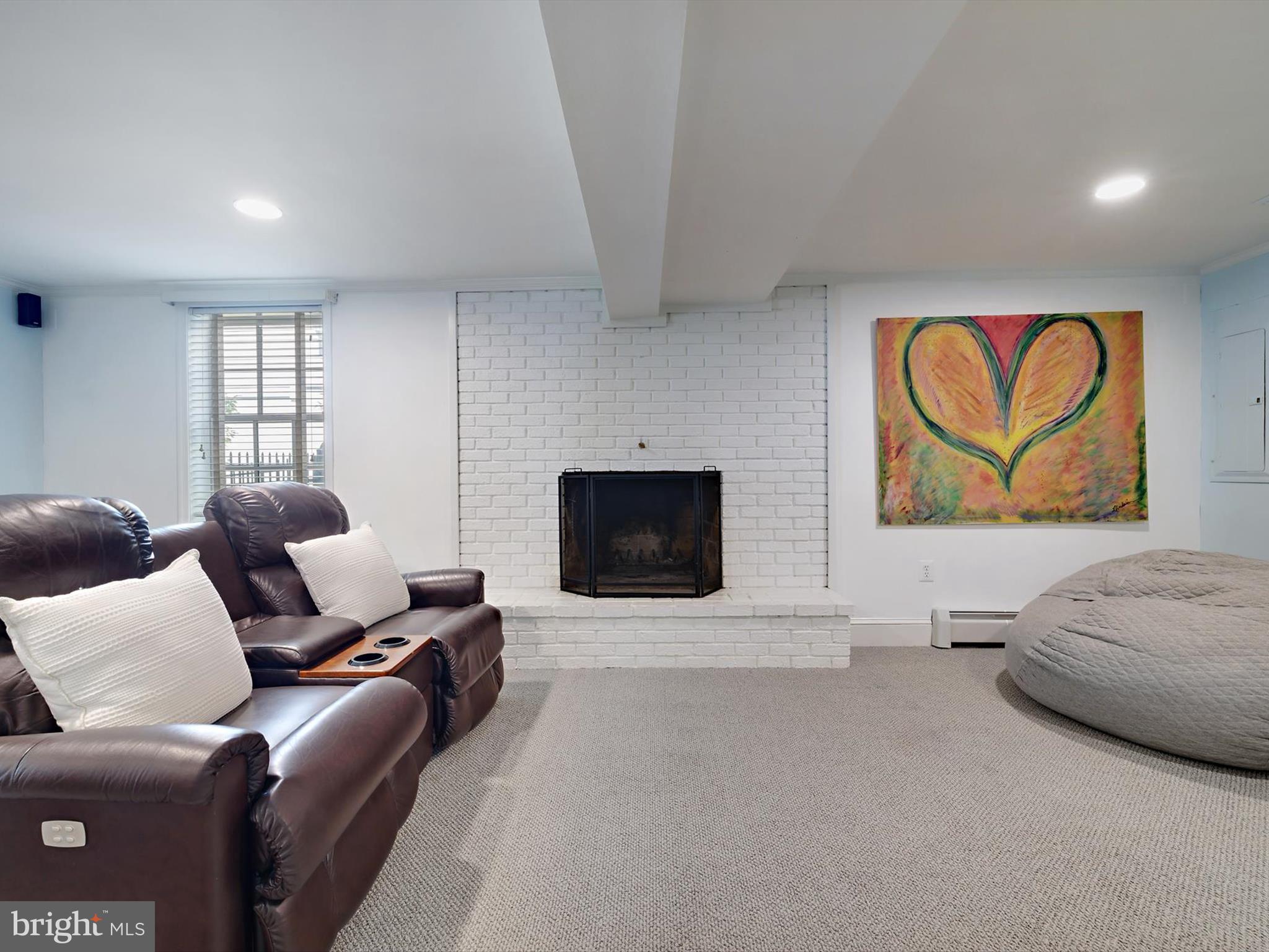 6 Brice Road Annapolis, MD 21409 - Photo 37 of 107 a living room with furniture and a fireplace
