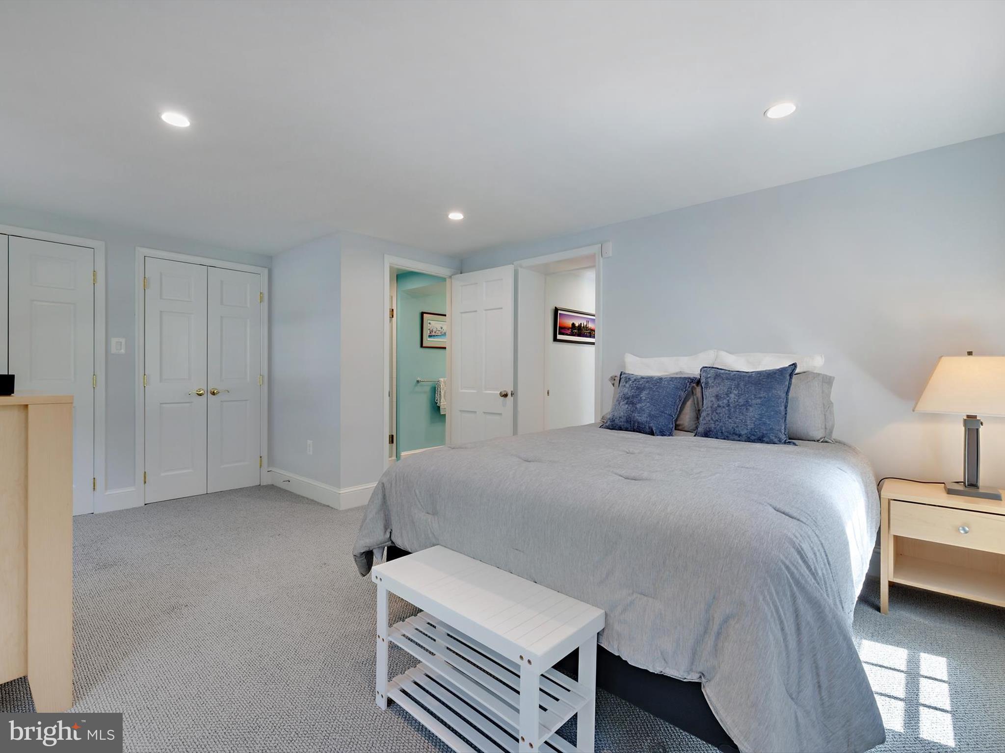 6 Brice Road Annapolis, MD 21409 - Photo 40 of 107 a spacious bedroom with a bed and a lamp