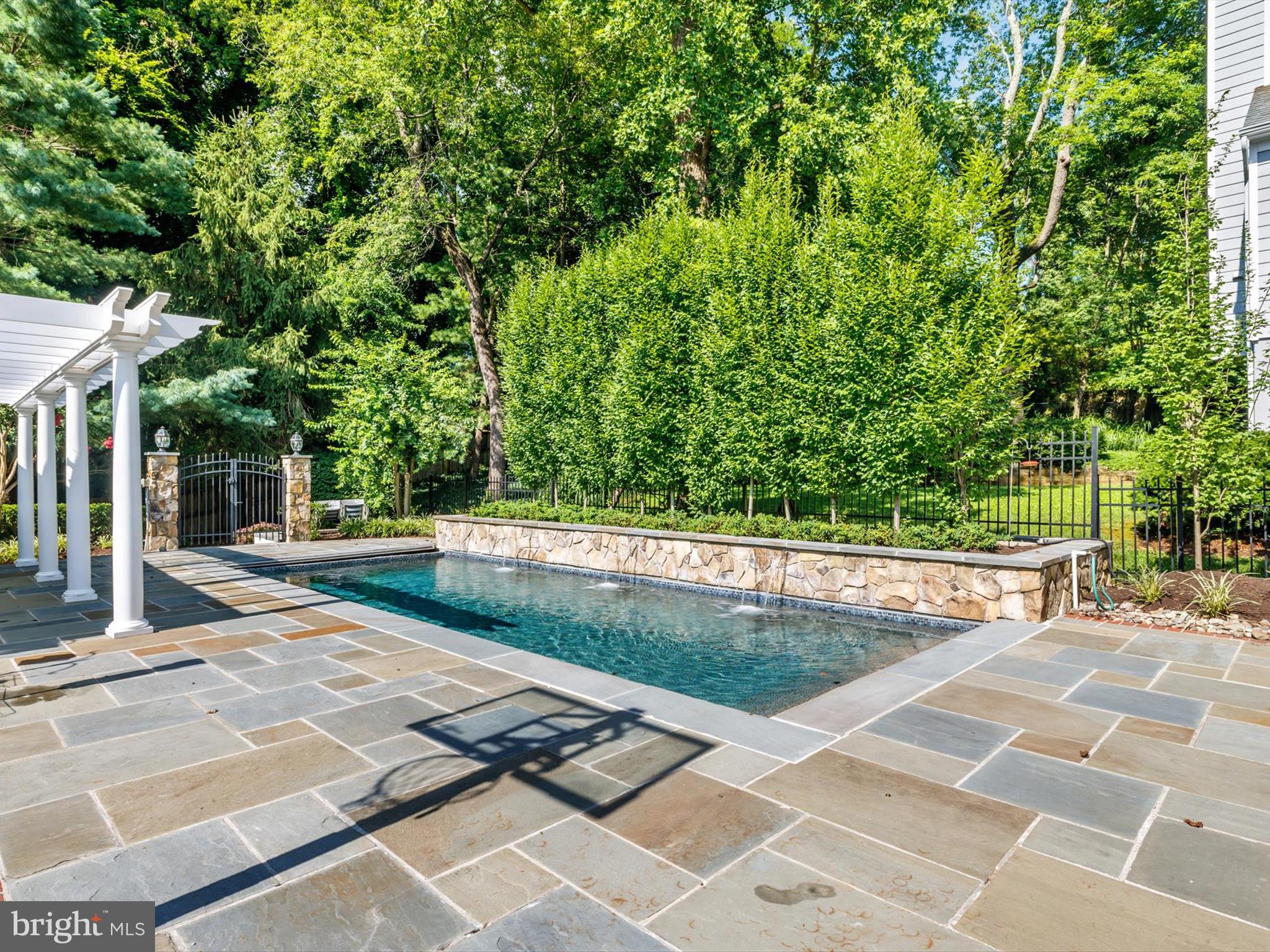 6 Brice Road Annapolis, MD 21409 - Photo 56 of 107 a view of a swimming pool with an outdoor space and seating area