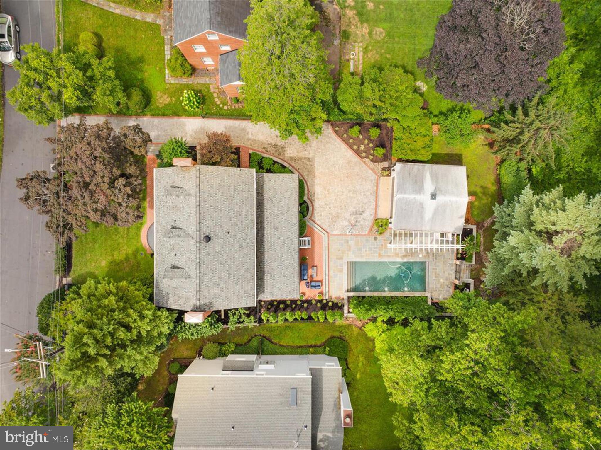 6 Brice Road Annapolis, MD 21409 - Photo 88 of 107 an aerial view of a house with a garden and trees