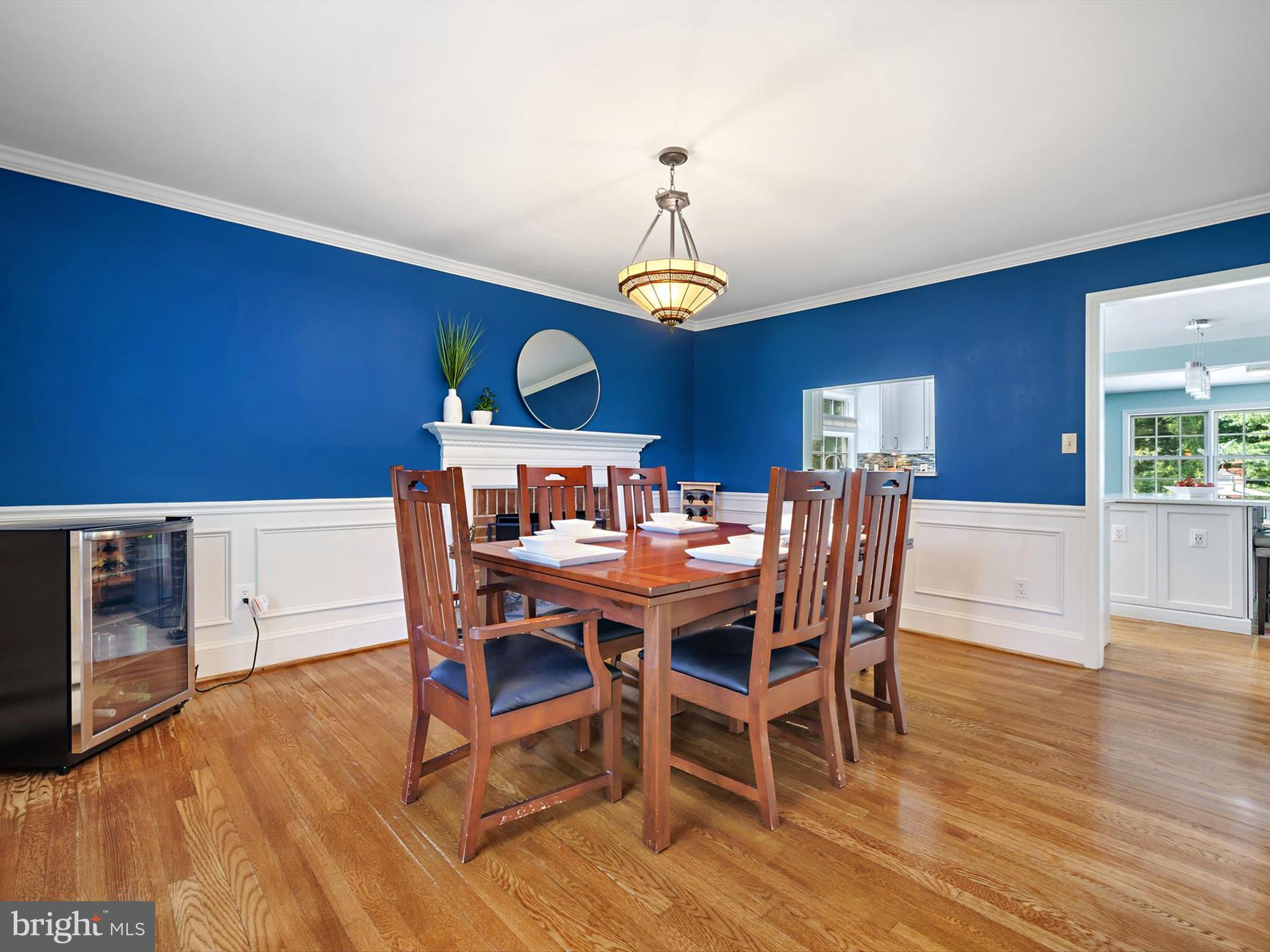 6 Brice Road Annapolis, MD 21409 - Photo 9 of 107 a dining room with furniture a chandelier and wooden floor