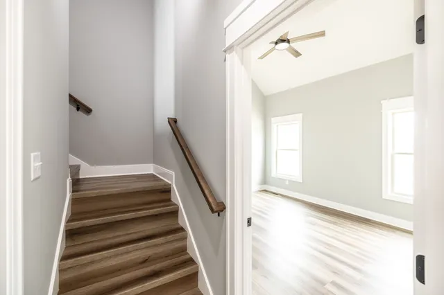 a view of a house with potted plants