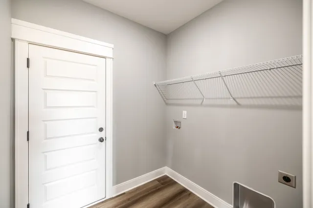 a view of a house with snow on the road