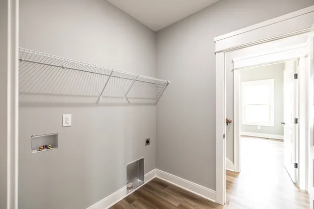 a view of wooden house with a wooden fence