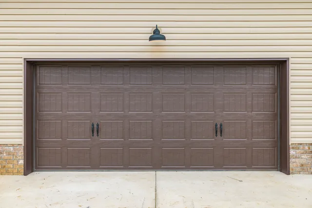 a view of a kitchen with wooden floor and a window