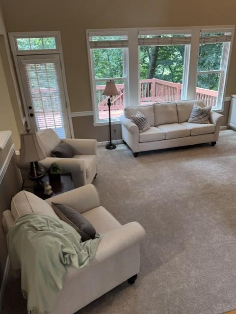 4055 Vista Point Lane Suwanee, GA 30024 - Photo 12 of 42 a living room with furniture and a large window
