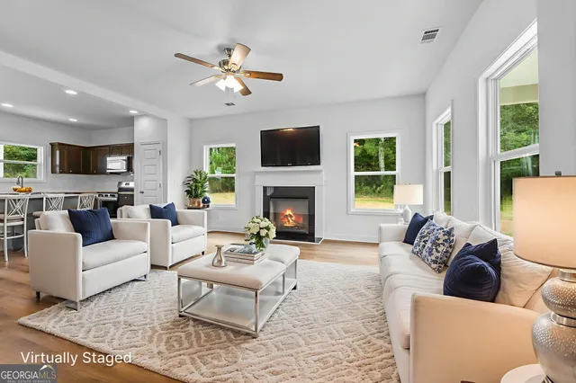 a kitchen with stainless steel appliances granite countertop a sink stove and microwave