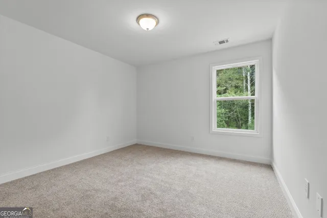 a front view of house with yard and lake view